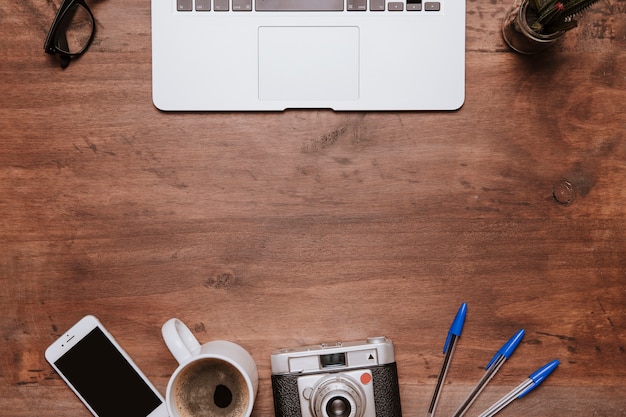 Wooden desk concept with space below laptop