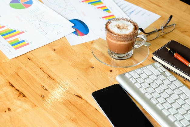 Free photo wooden desktop in modern office with accessories - top view on desk from above