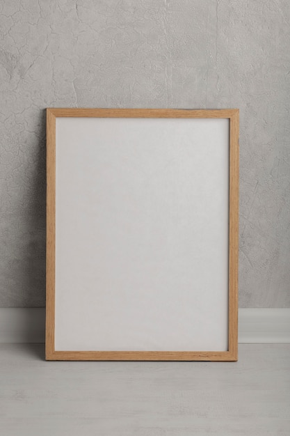 Free photo wooden empty frame front view