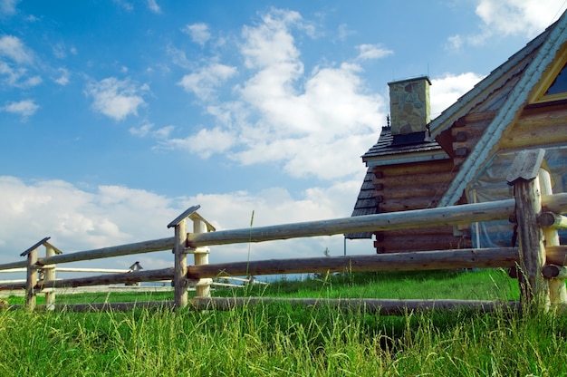 Free Photo wooden fence with a house behind