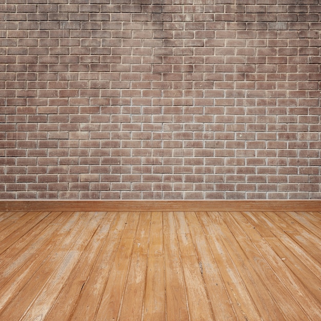 Free photo wooden floor with brick wall