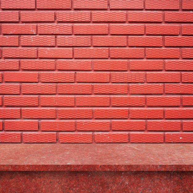 Wooden floor with brick wall