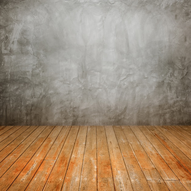 Free photo wooden floor with a concrete wall