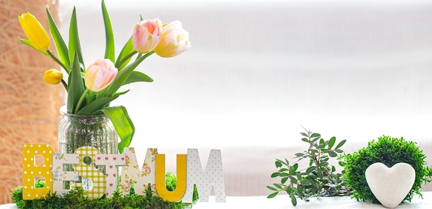 Wooden inscription for mother's day on a wooden table