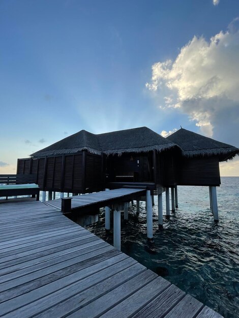 A wooden jetty in a luxury resort baa atoll maldives