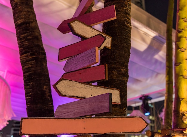 Free photo wooden road signs in the evening