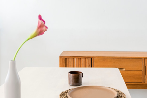 Free photo wooden sideboard by a white wall