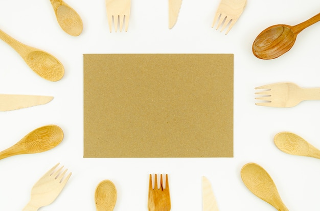 Wooden spoon and fork on white background