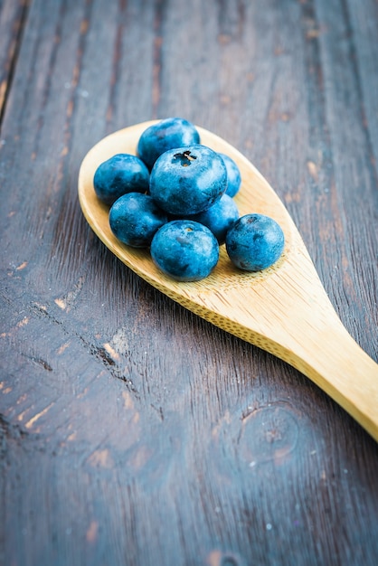 Wooden spoon with blueberries