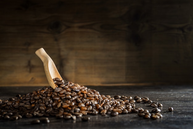 Wooden spoon with coffee beans