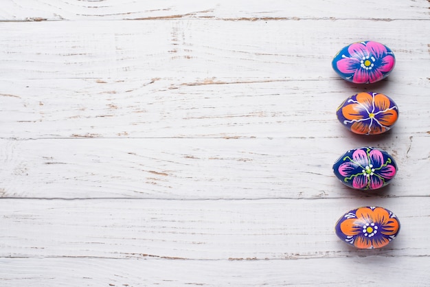 Wooden surface with four great easter eggs