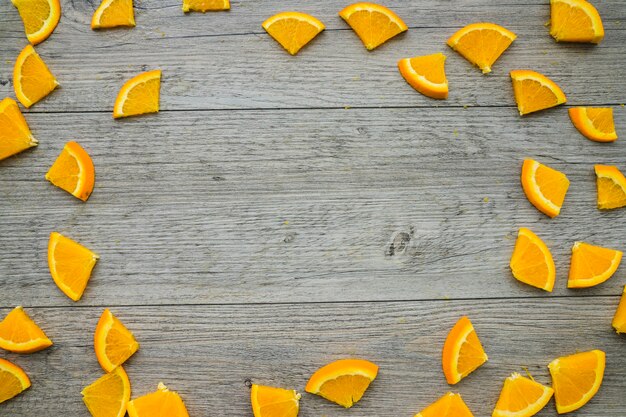 Wooden surface with frame made of orange pieces