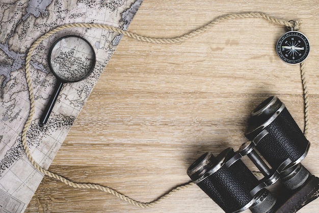 Wooden surface with map and other travel elements