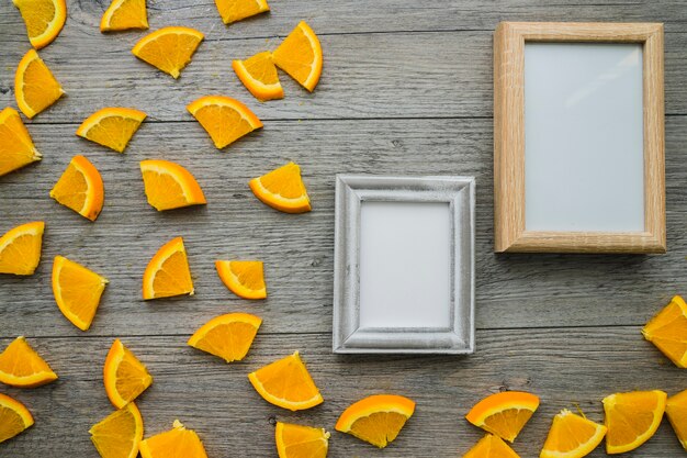 Wooden surface with orange pieces and frames