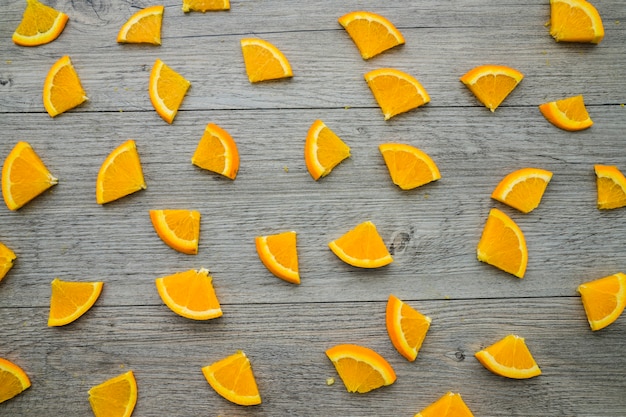 Wooden surface with orange pieces