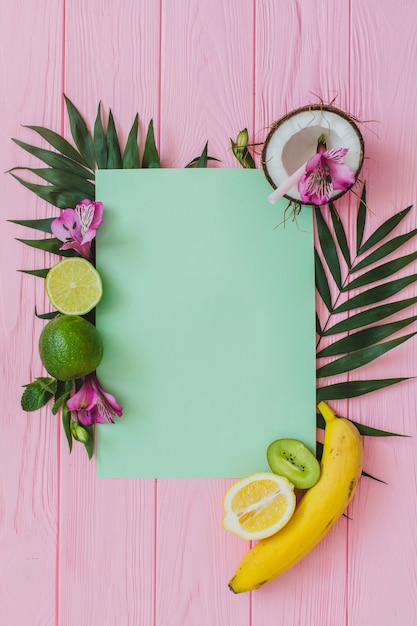 Free Photo wooden surface with piece of paper and fruits