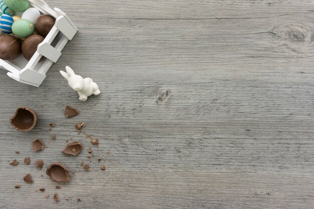 Wooden surface with rabbit and easter eggs