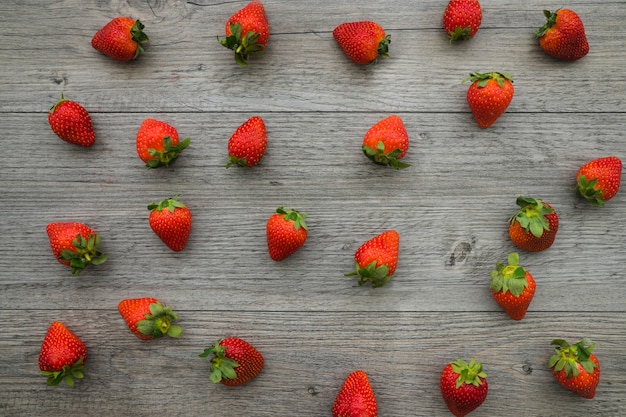 Wooden surface with strawberries