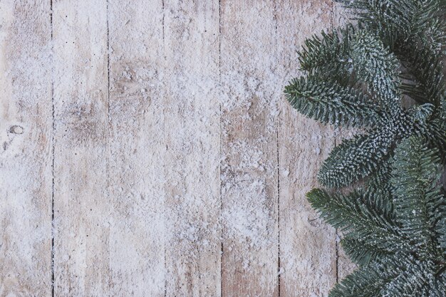 Wooden table with pine leaves