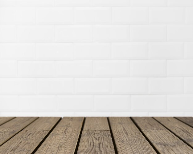 Wooden texture looking out to white brick wall