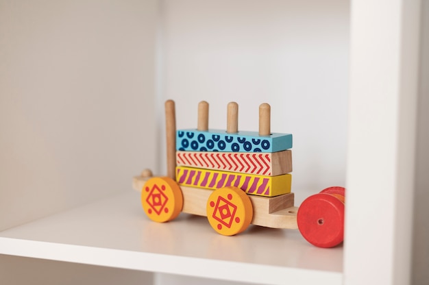 Wooden toy on white shelf