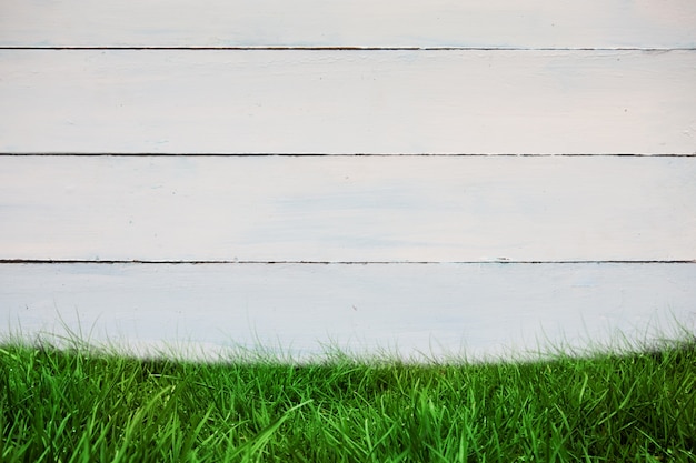 Free Photo wooden wall with grass