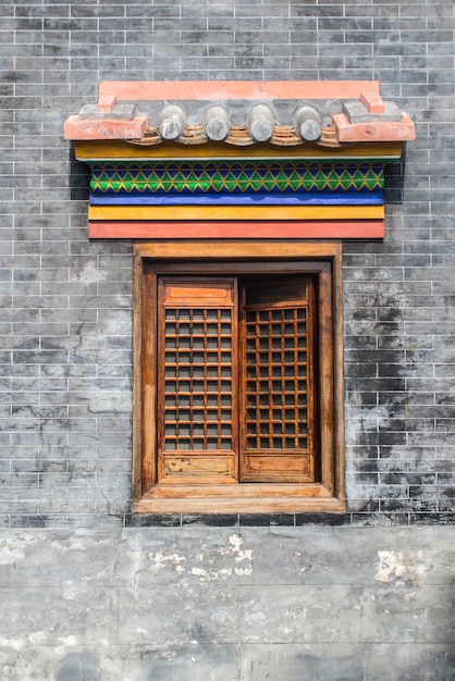 Wooden window in brick facade