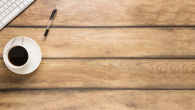 Wooden workplace with coffee