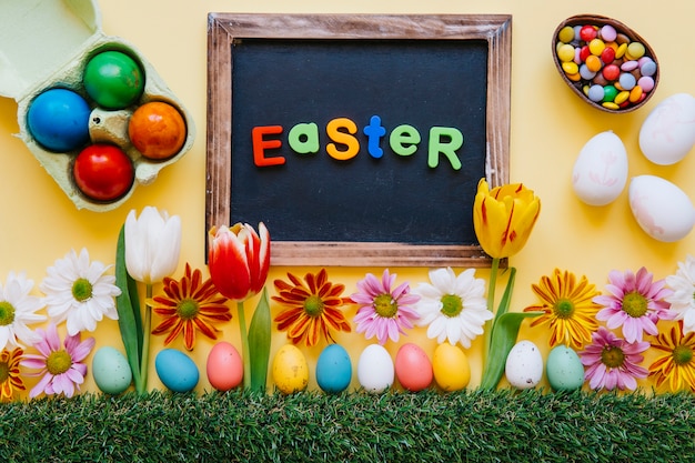 Free photo word easter on board with flowers