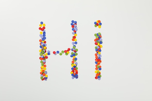 Free photo the word hi is made of colored plasticine on a white background