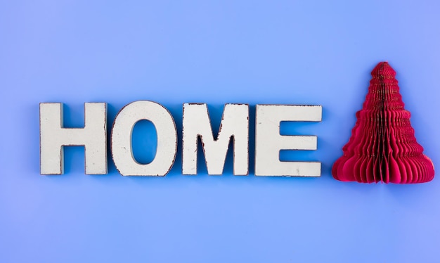 Free Photo the word home from wooden letters on a blue background