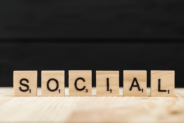 Free Photo the word social spelt with wooden letters