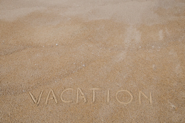 Free photo word written on sand