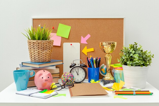 Work place of a creative person with a variety of colorful stationery objects