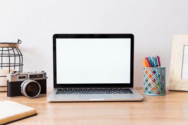  Work space with laptop and camera in arrangement