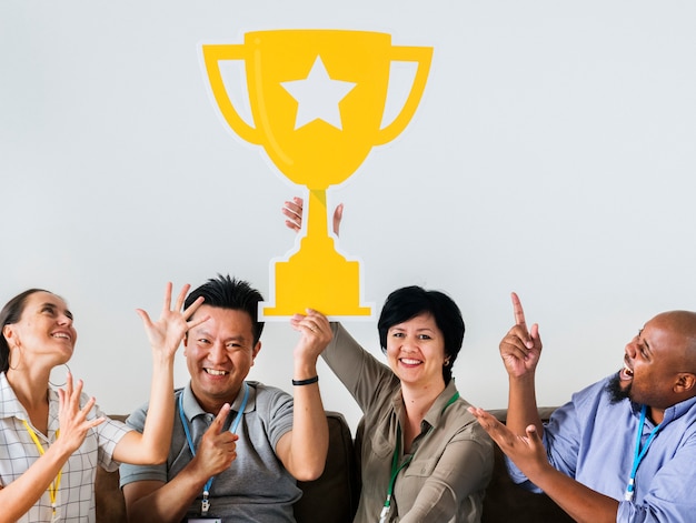 Free Photo workers celebrating their success with a trophy