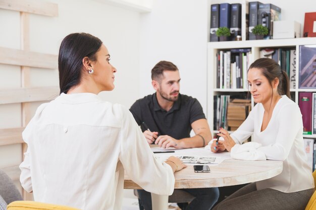 Workers communicating on meeting