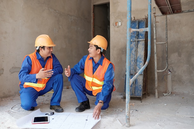 Workers discussing project