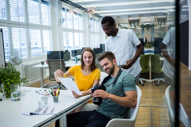 Workers smiling and looking results on paper