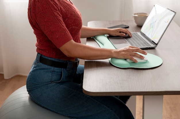 Free photo working from home in ergonomic workstation