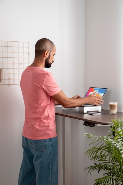 Free photo working from home in ergonomic workstation