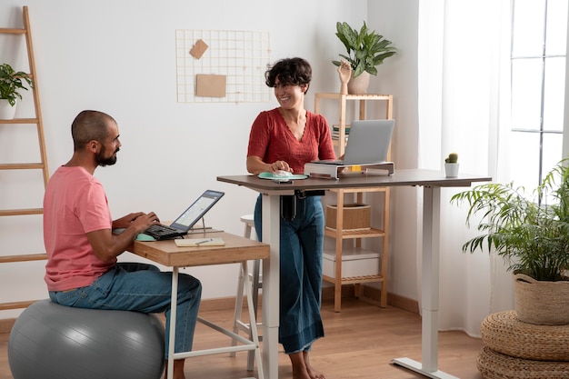 Free photo working from home in ergonomic workstation