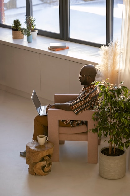 Free photo working from home in ergonomic workstation