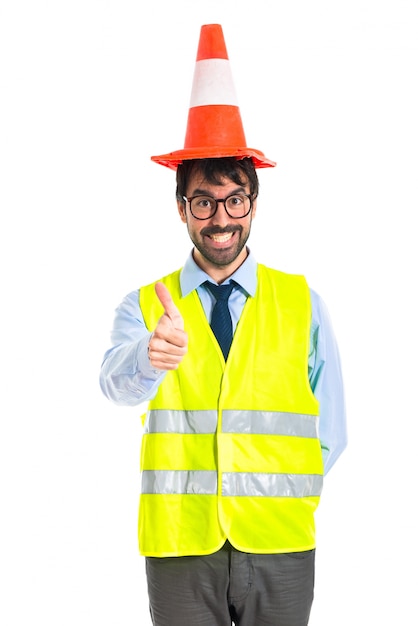 Free photo workman with thumb up with traffic cone like hat