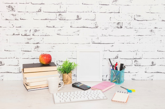 Workplace with books and keyboard