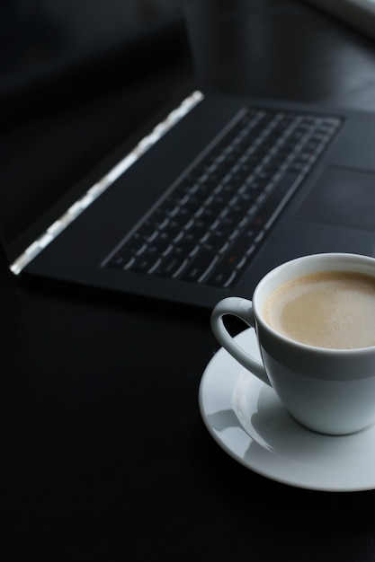 Free Photo workplace with computer and coffee cup