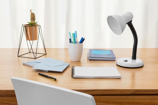 Free Photo workspace composition with desk lamp