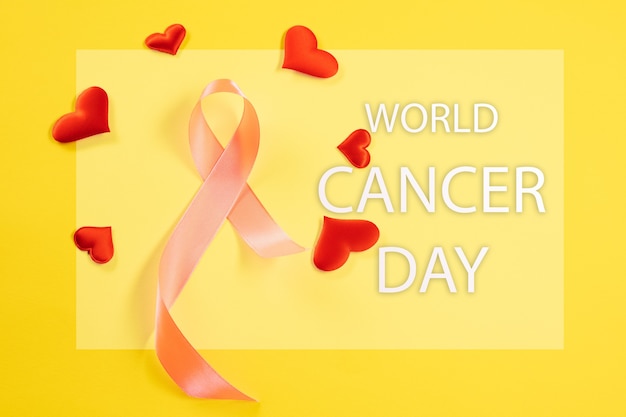 Free Photo world cancer day card with pink ribbon and red hearts