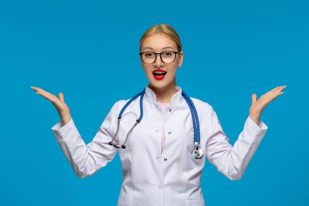 World doctors day excited doctor waving hands with the stethoscope in the medical coat