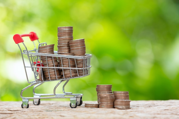 Free photo world habitat day,close up picture of little cart which full of coins